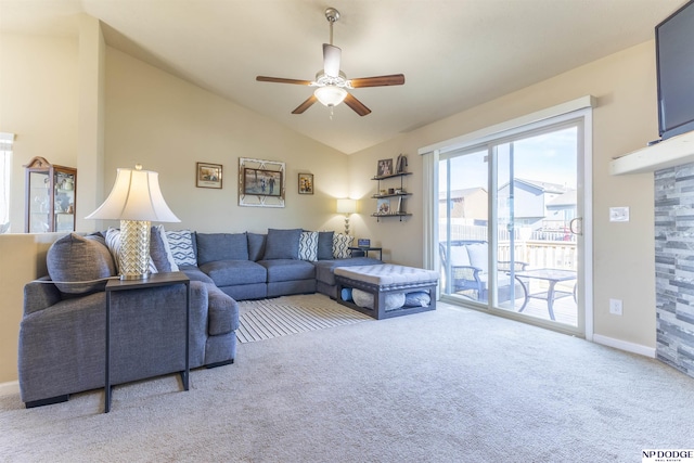 carpeted living room featuring ceiling fan and vaulted ceiling