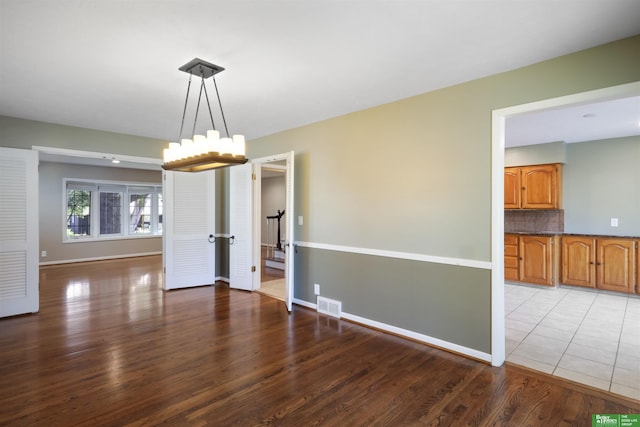 unfurnished dining area with hardwood / wood-style flooring