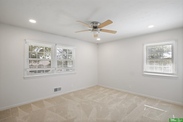 carpeted empty room with ceiling fan