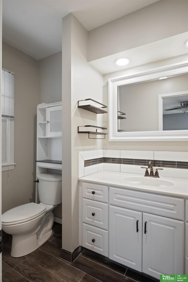 bathroom with toilet and vanity