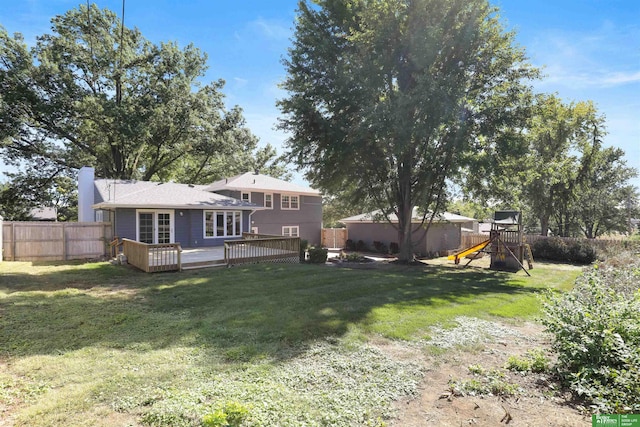 view of yard with a playground and a deck