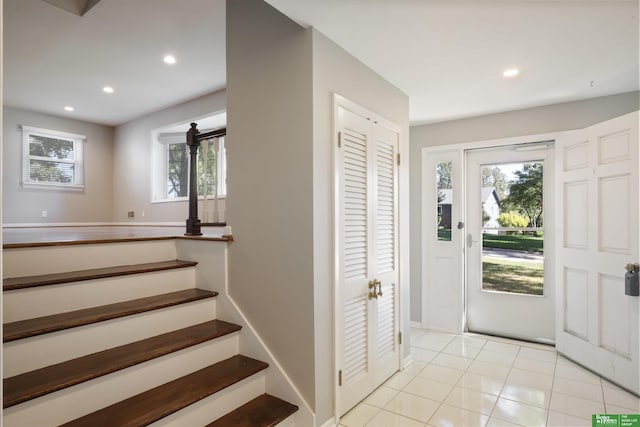 entrance foyer with light tile patterned floors