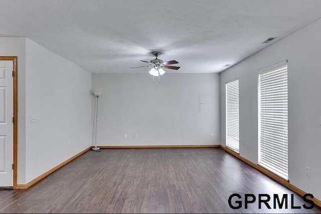 unfurnished room with ceiling fan and hardwood / wood-style floors