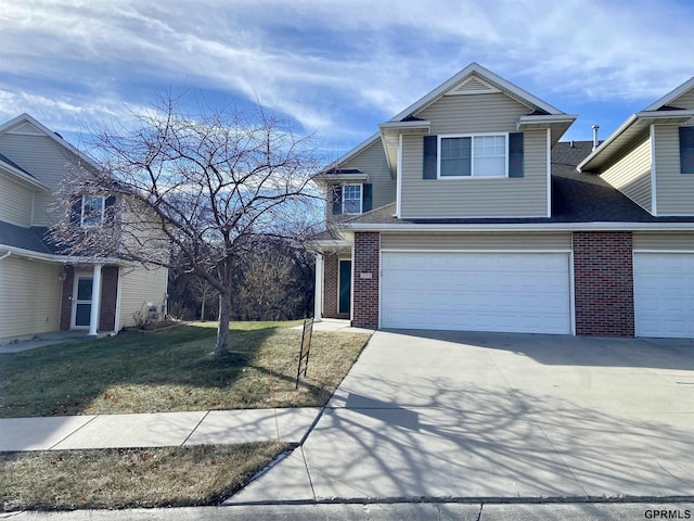 view of front property featuring a front lawn and a garage