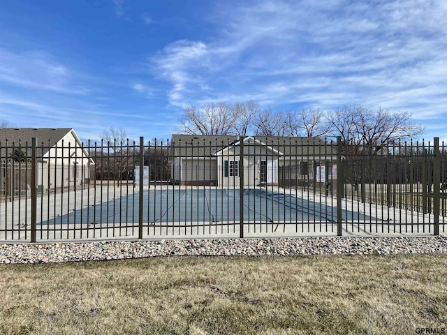 view of swimming pool with a patio area and a yard