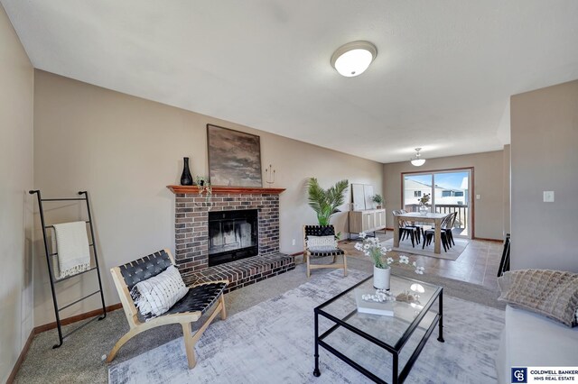 carpeted living room with a fireplace