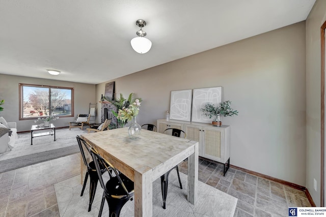 dining space with a fireplace