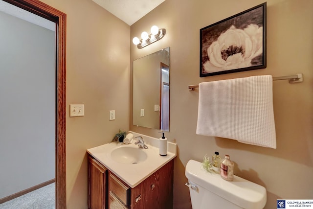 bathroom with toilet and vanity