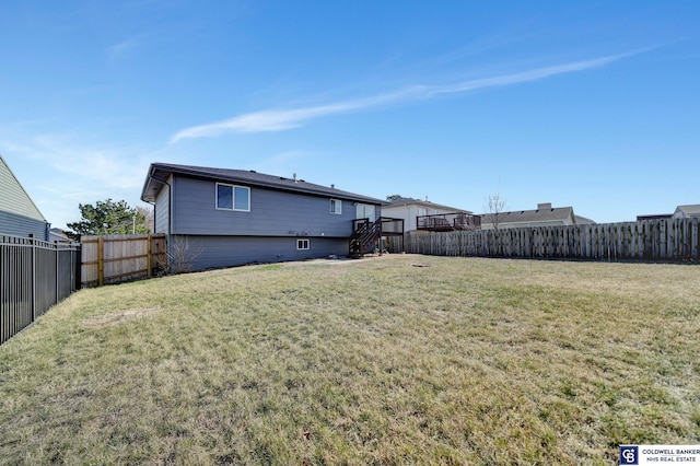 back of house with a lawn