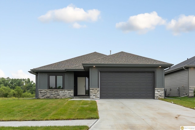 view of front of house with a front lawn and a garage