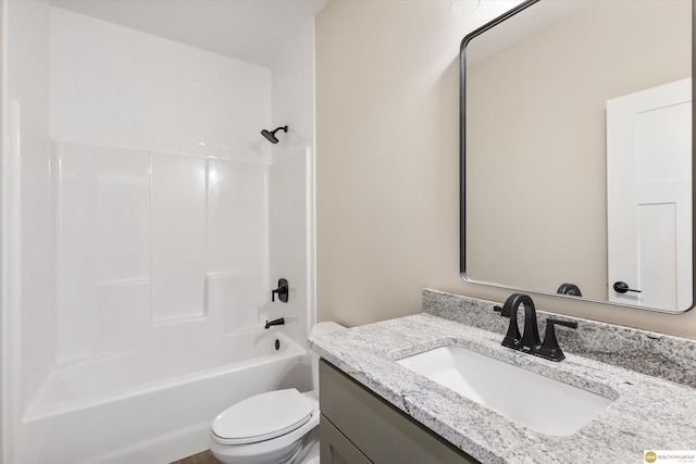 full bathroom featuring toilet, vanity, and shower / washtub combination