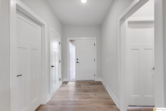 doorway to outside featuring light hardwood / wood-style flooring