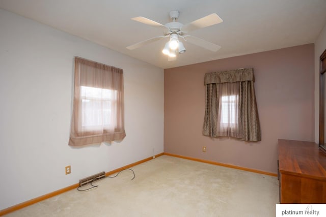 carpeted empty room with ceiling fan