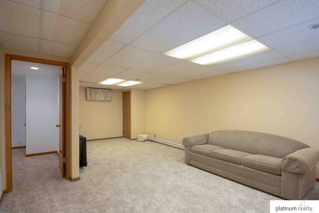 interior space with a paneled ceiling