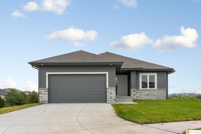 view of front facade with a front lawn and a garage