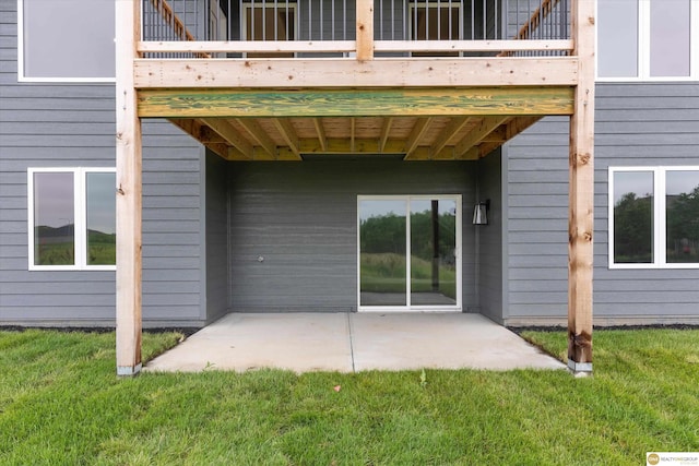 exterior space featuring a lawn and a patio area