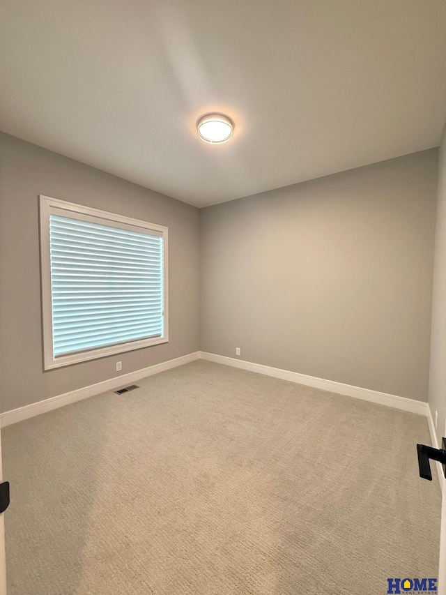 view of carpeted spare room