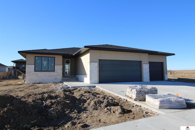 prairie-style home featuring a garage