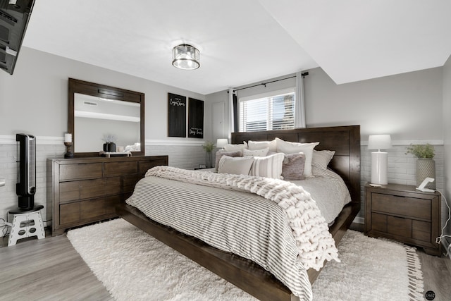 bedroom with light hardwood / wood-style floors