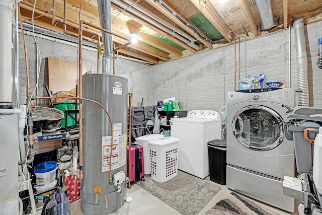 laundry area with separate washer and dryer and gas water heater