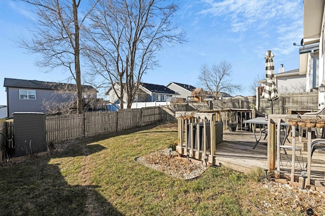 view of yard with a wooden deck