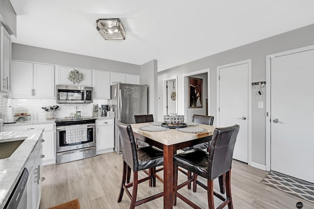 dining area featuring light hardwood / wood-style floors