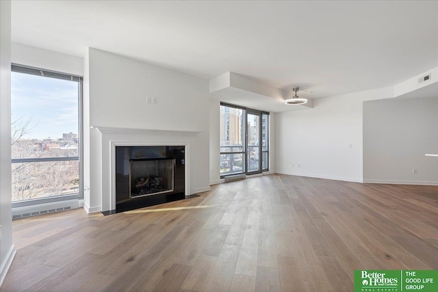 unfurnished living room featuring light hardwood / wood-style floors