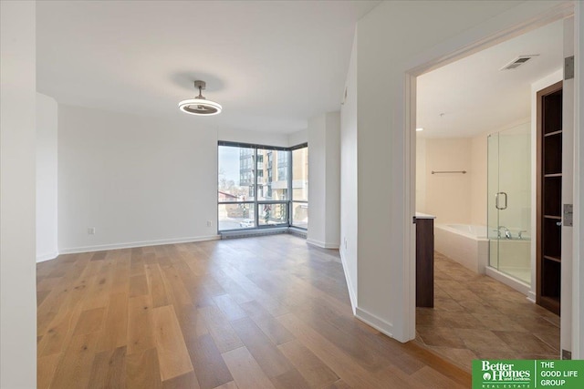 unfurnished room featuring light wood-type flooring