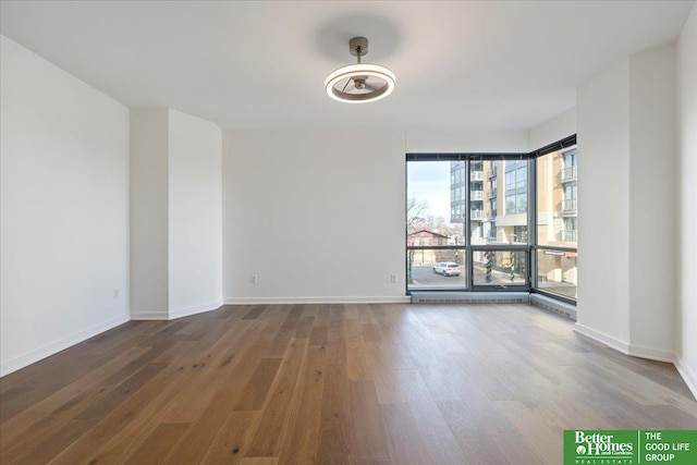 empty room with wood-type flooring