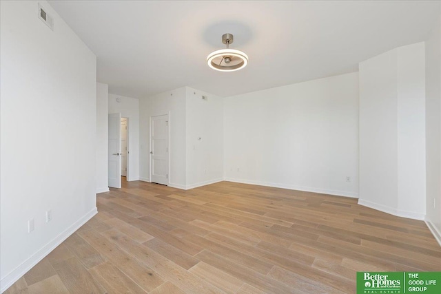 unfurnished room with light hardwood / wood-style floors