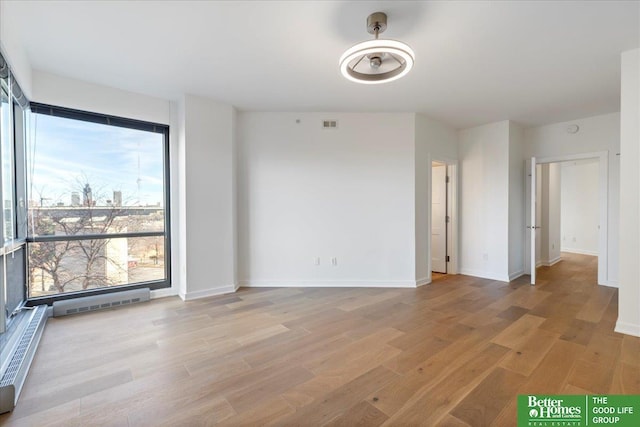 empty room with light wood-type flooring