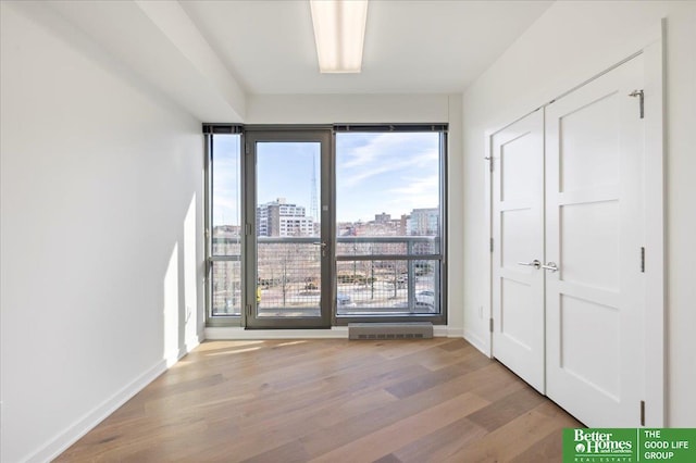 spare room with light hardwood / wood-style floors