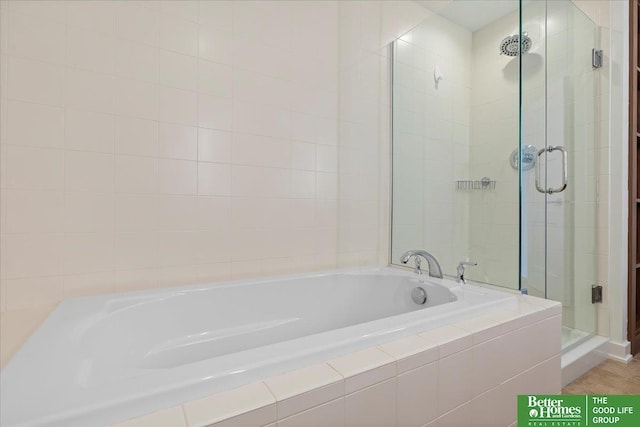 bathroom with shower with separate bathtub