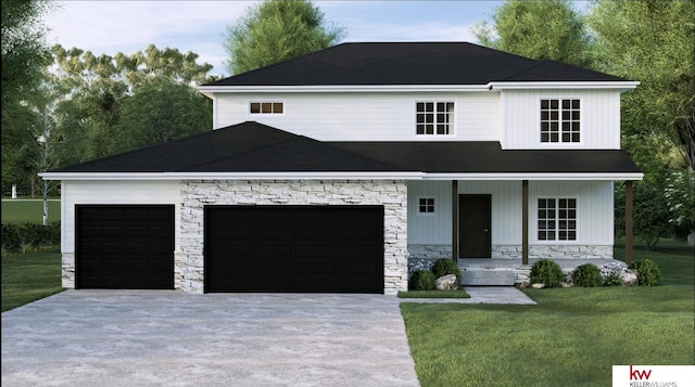 view of front of property featuring a front lawn and a garage