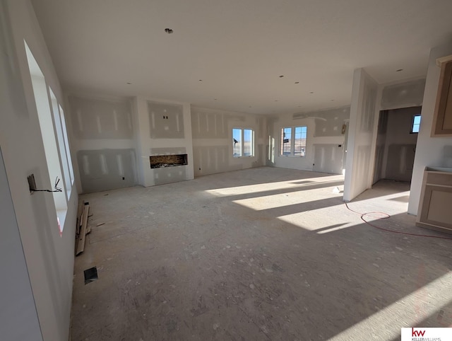 unfurnished living room featuring a fireplace