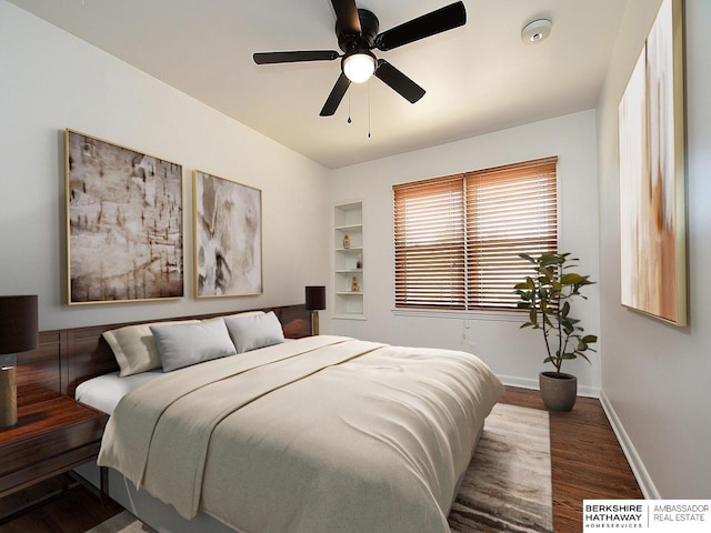 bedroom featuring ceiling fan and dark hardwood / wood-style flooring