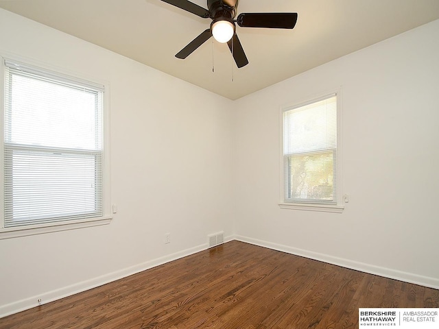 empty room featuring ceiling fan and wood-type flooring