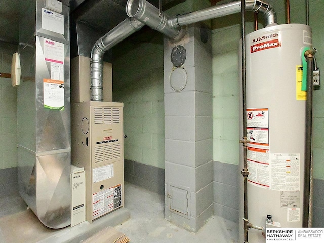 utility room with heating unit and gas water heater