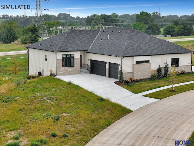 view of front of property with a front yard and a garage