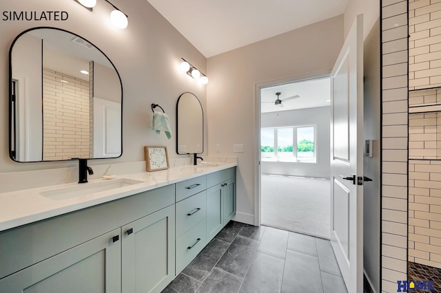 bathroom with ceiling fan, vanity, and walk in shower