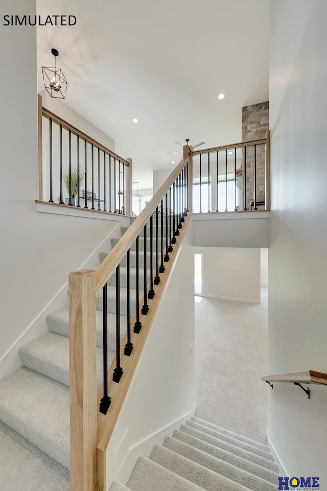 stairs featuring carpet floors and a notable chandelier