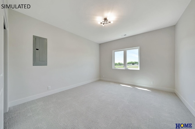 carpeted spare room featuring electric panel