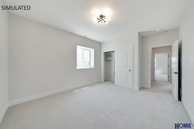 unfurnished bedroom featuring a closet and light colored carpet