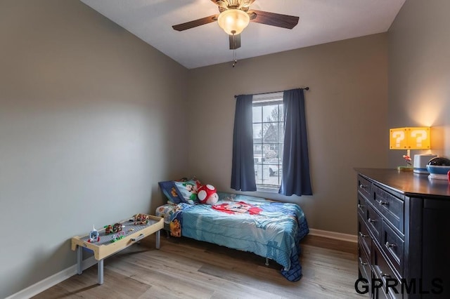 bedroom with ceiling fan and light wood-type flooring