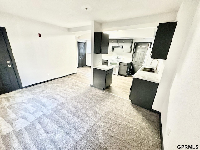 kitchen featuring sink, electric stove, light hardwood / wood-style flooring, and extractor fan