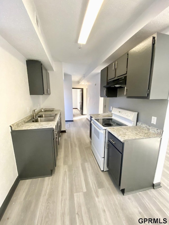 kitchen featuring light hardwood / wood-style floors, sink, a textured ceiling, and white electric stove