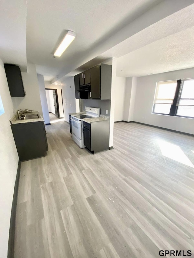 kitchen with white electric range, sink, range hood, and light hardwood / wood-style floors