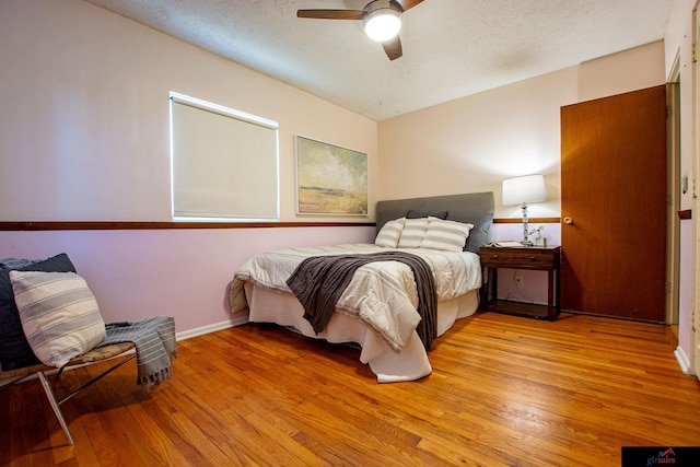 bedroom featuring ceiling fan and light hardwood / wood-style floors