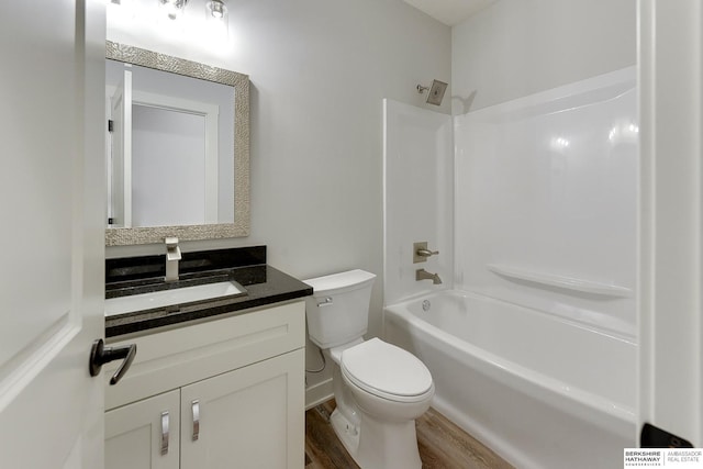 full bathroom with toilet, shower / bath combination, hardwood / wood-style floors, and vanity