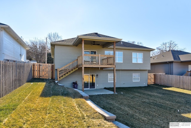 rear view of property with a lawn, ceiling fan, and a patio area